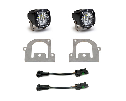Baja Designs S1 Fog Pocket Light Kit, complete kit on a studio background: pair of black S1 pods with clear lenses, two bare steel fog pocket adapter plates and two adapter harnesses on white