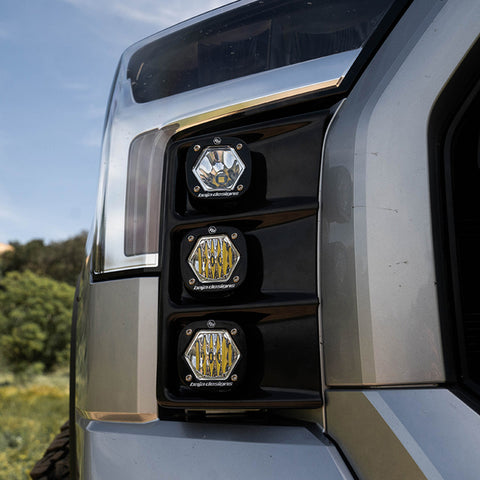 Baja Designs S1 Vent Kit on a Toyota Tundra: three small Baja Designs S1 pods sit stacked in the front bumper vent of a silver pickup