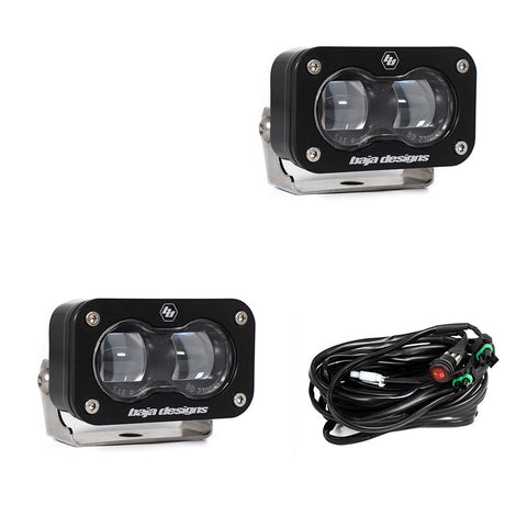 Baja Designs S2 SAE LED Auxiliary Light Pod Pair, whole product on a studio background: two black S2 SAE LED pods with clear projector lenses and a wiring harness with switch on a white background