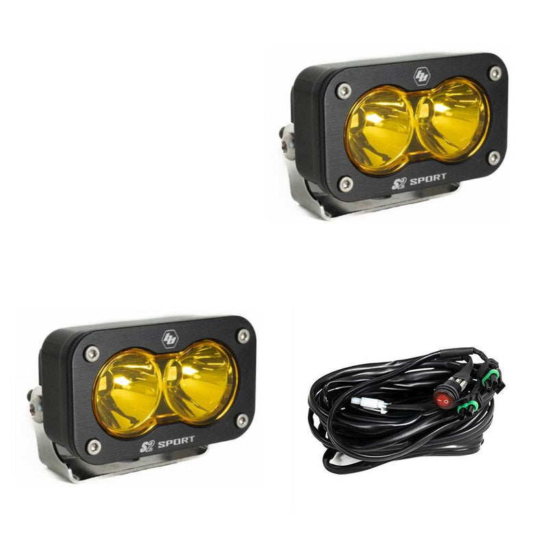 Baja Designs S2 Sport Black LED Auxiliary Light Pod Pair, whole product on a studio background: pair of black S2 Sport light pods with amber spot reflectors and a wiring harness on a white background