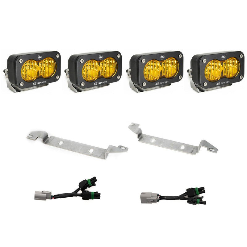 Baja Designs S2 Sport OEM Fog Light Replacement Kit, complete kit on a studio background: four black S2 Sport pods with amber lenses, two silver bumper brackets and two Y harnesses with gray factory plugs on white