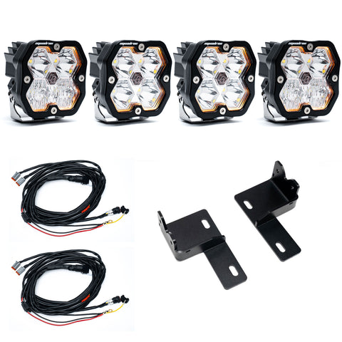 Baja Designs Squadron 2.0 Sport Behind-the-Grille Light Kit, complete kit on a studio background: four clear Squadron 2.0 pods with two wiring harnesses and two black steel brackets on white