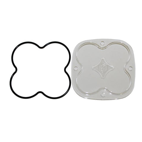 Baja Designs Squadron Light Pod Lens Kit, complete kit on a studio background: A clear rounded-square Squadron replacement lens with a smooth spot optic lies beside its black O-ring gasket on a white background