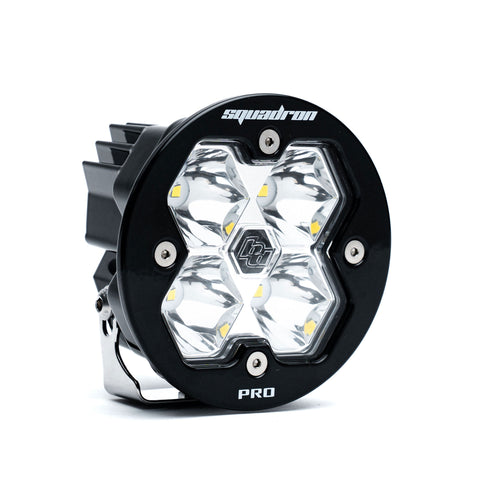 Baja Designs Squadron-R 2.0 Pro Black LED Auxiliary Light Pod, whole product on a studio background: A round black Squadron-R Pro LED pod with a clear spot lens on a white background