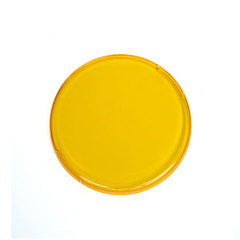 Baja Designs Squadron-R 2.0 Single Rock Guard, whole product on a studio background: an amber round snap-on rock guard cover on white
