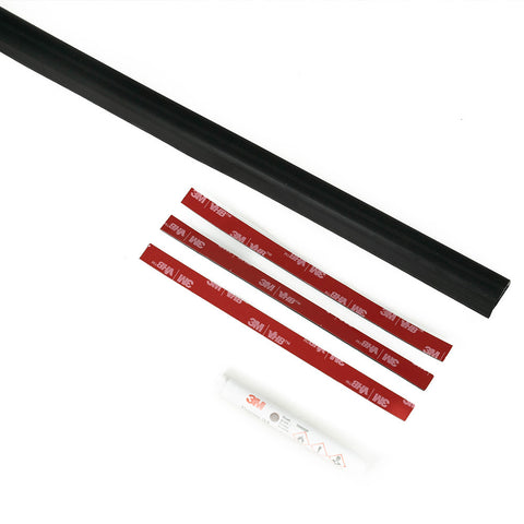 Baja Designs Wire Hider Kits, complete kit on a studio background: A black rubber wire hider channel with three adhesive tape strips and a surface prep swab on a white background