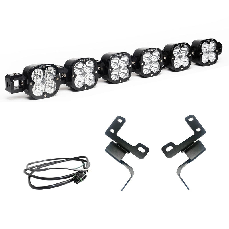 Baja Designs XL Linkable Bumper Light Kit, complete kit on a studio background: six XL Pro pods joined as one linkable bar with two bent black brackets and a wiring harness on white