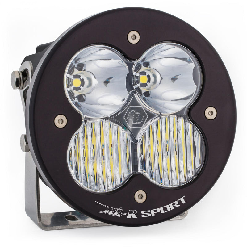 Baja Designs XL-R Sport LED Auxiliary Light Pod, whole product on a studio background: A single black round Baja Designs XL-R Sport LED light pod with a clear driving/combo lens on a steel mounting bracket, shown on white