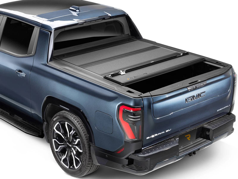 BAKFlip MX4 hard folding tonneau cover on a GMC Sierra EV, rear panel folded forward