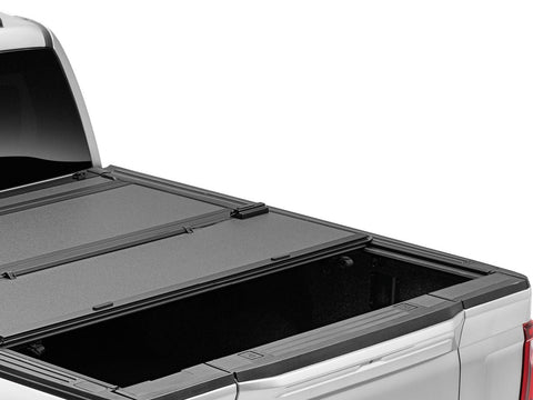 BAKFlip MX4 hard folding tonneau cover seen from above the bed rails, rear panel folded forward