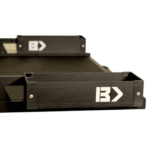 Black Edition BEDSLIDE BEDBIN Mini Kix bin, studio view showing the matte black 7" x 18" tray with the white BEDSLIDE arrow decal