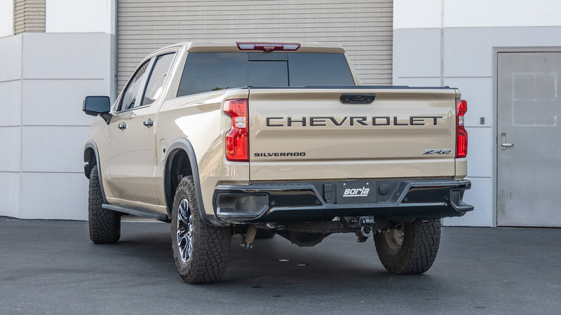 Borla S-Type Cat-Back Exhaust System installed on a Chevrolet Silverado: tan Chevrolet Silverado ZR2 seen from the rear quarter with exhaust tips below the rear bumper