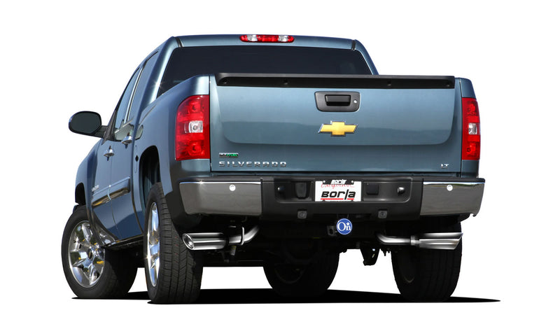 Borla Touring Cat-Back Exhaust System installed on a Chevrolet Silverado 1500: blue Chevrolet Silverado LT seen straight from the rear with polished exhaust tips exiting at both rear corners and a Borla plate