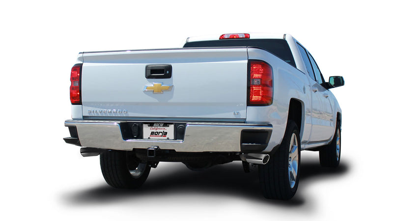 Borla Touring Cat-Back Exhaust System installed on a Chevrolet Silverado 1500: rear three-quarter view of a silver Chevrolet Silverado crew cab on white with an exhaust tip visible under the passenger side of the bumper