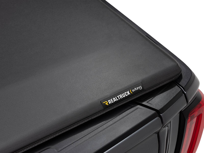 Closed soft tonneau cover corner with the Extang badge near the tailgate