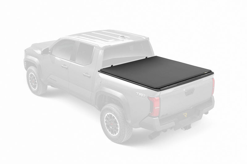 Canvas soft tri-fold tonneau cover closed over the bed, studio render with the truck faded out