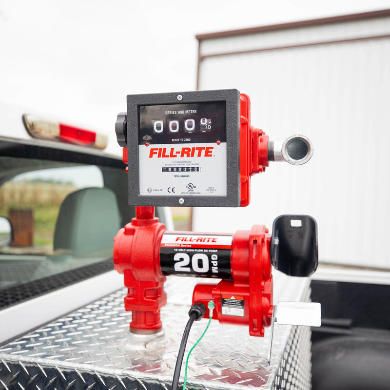 Fill-Rite FR4211HN 20 GPM, 12V DC Pump, 5' Ground Wire, 18'12 Gauge 2 Wire Battery Cable & 901c Gallon, mounted on a diamond-plate transfer tank in a pickup bed