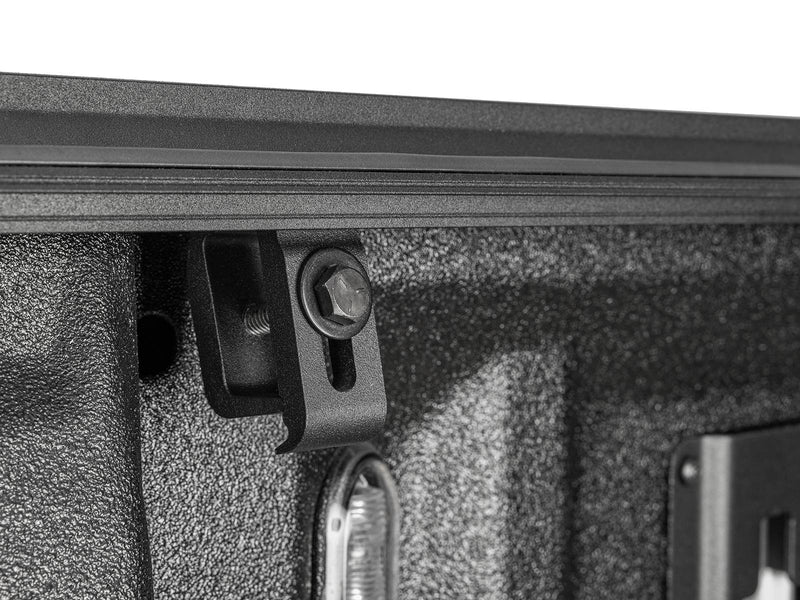 Gator EFX hard folding tonneau cover: Close-up of a cover clamp bolted under the bed rail