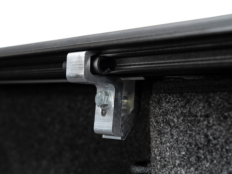Close-up of the Gator EFX tonneau cover: close-up of an aluminum mounting clamp under the cover rail