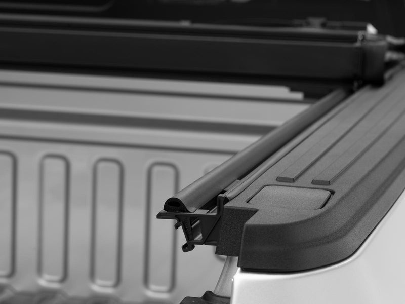 Gator EFX hard folding tonneau cover: Close-up of the folded hard cover stack and its clamp on the bed rail