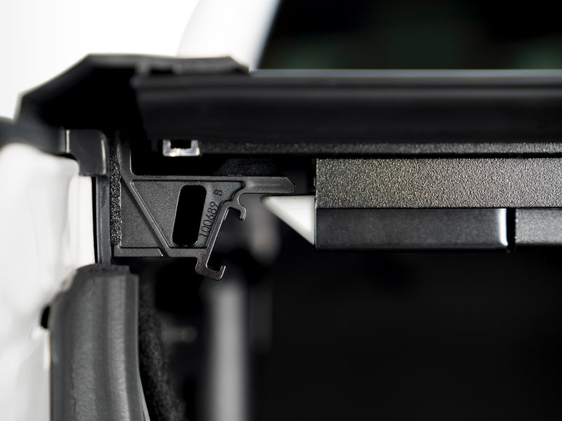 Gator EFX hard folding tonneau cover: Close-up of the rail and seal profile at the front corner of the bed