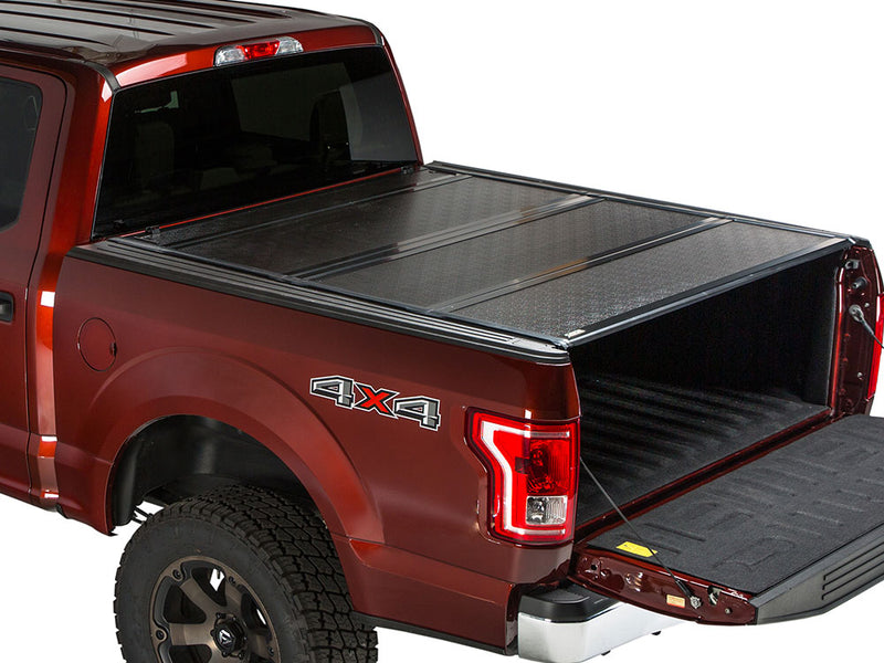 Gator FX hard folding tonneau cover: closed on a red Ford pickup with the tailgate down