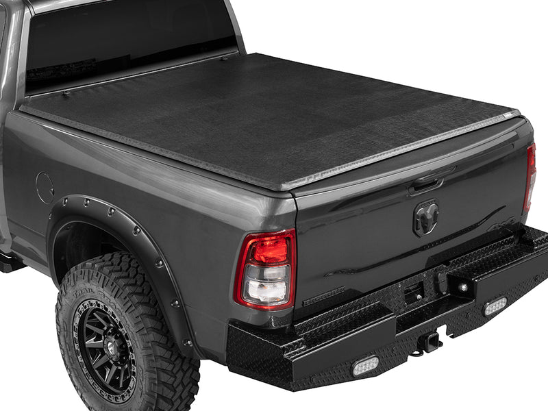Gator SFX soft tri-fold tonneau cover: closed on a black Ram pickup, rear three-quarter view