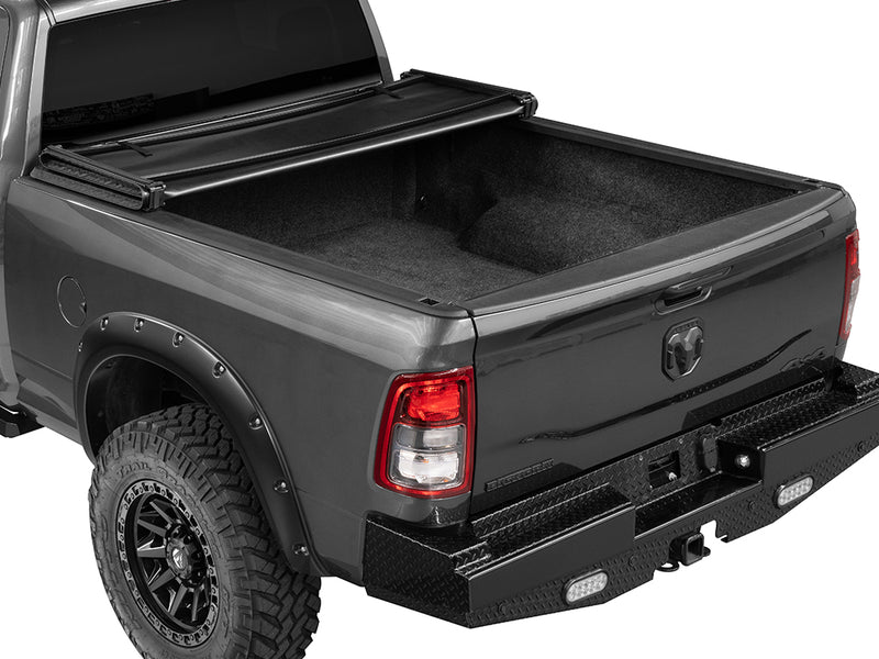 Gator SFX soft tri-fold tonneau cover: folded fully forward on a black Ram pickup