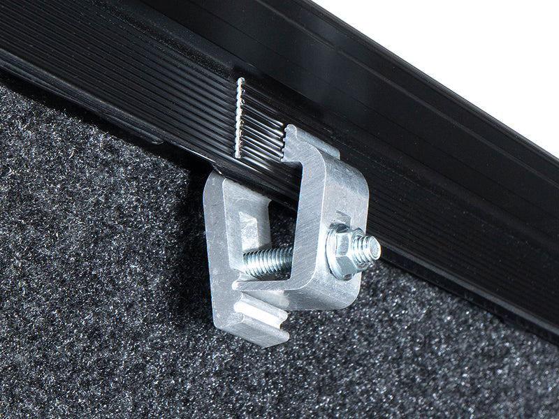 Gator SRX soft roll-up tonneau cover: Close-up of a metal clamp securing a soft roll-up tonneau side rail to the bed wall