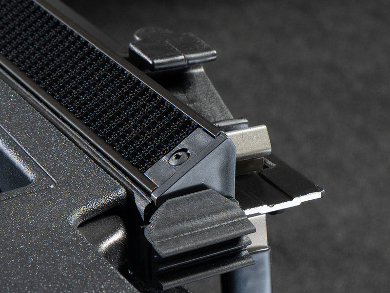 Gator SRX soft roll-up tonneau cover: Close-up of a soft roll-up tonneau rail end with its tailgate seal and the hook-and-loop strip