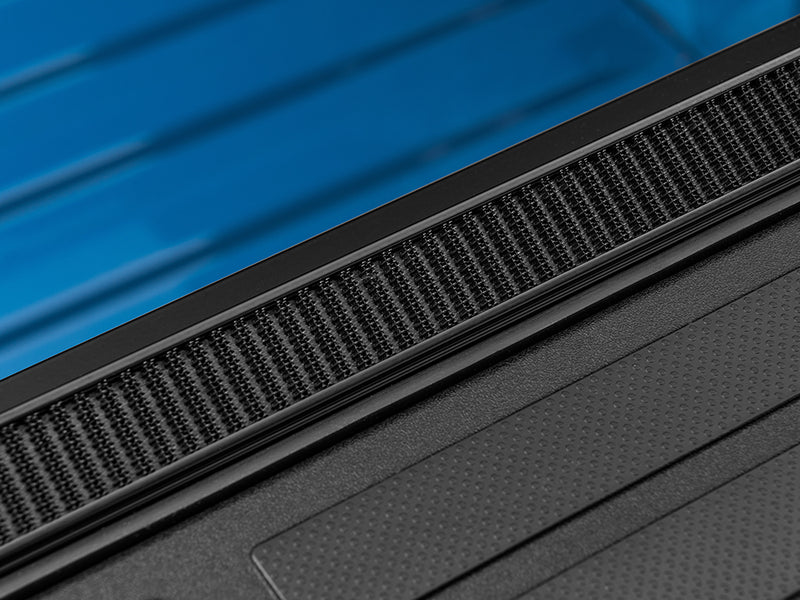 Gator SRX soft roll-up tonneau cover: Close-up of the hook-and-loop sealing strip along a soft roll-up tonneau side rail