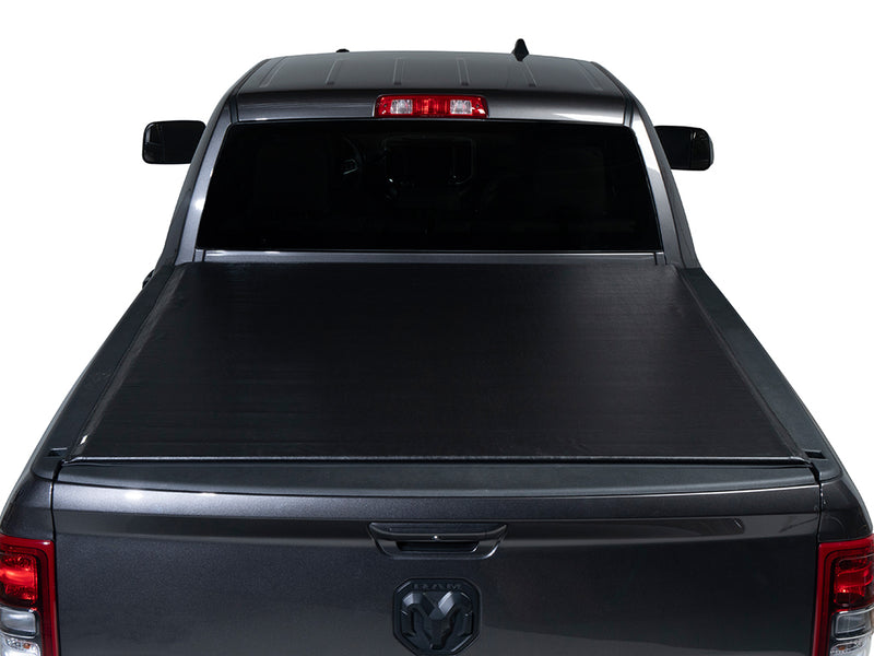 Gator SRX soft roll-up tonneau cover: Rear view of a gray Ram pickup with a black soft roll-up tonneau cover closed over the bed