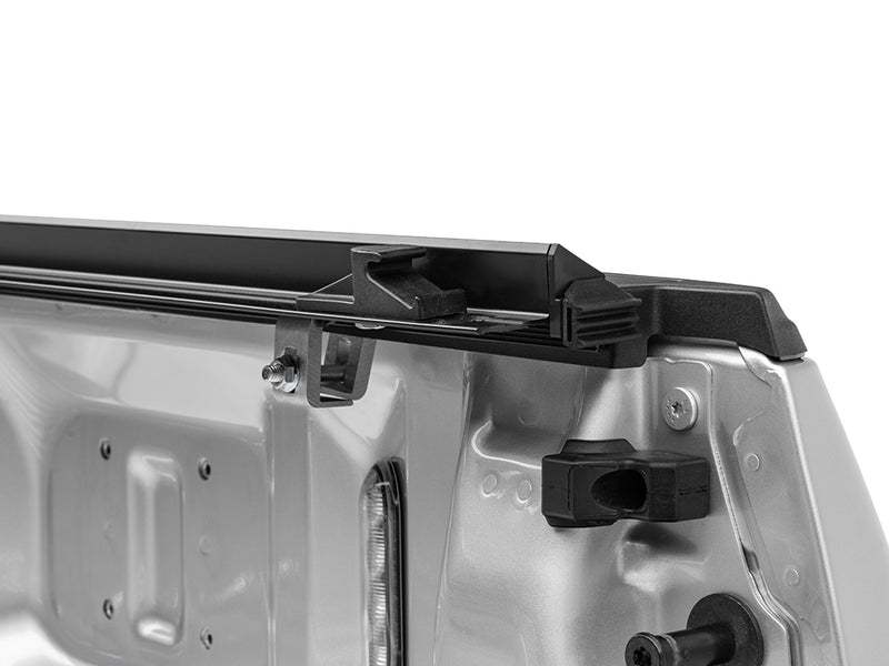 Gator SRX soft roll-up tonneau cover: Side rails with clamps mounted along the inside of a silver bed wall