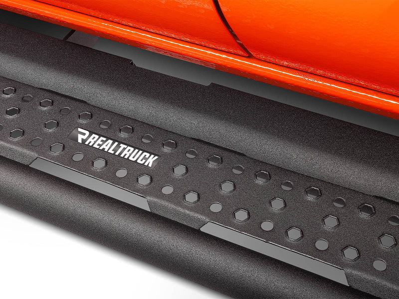 Go Rhino Dominator D6: close-up of a textured black side step tread with hex pattern under an orange body
