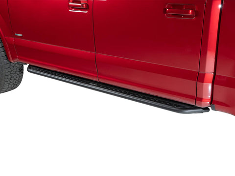 Go Rhino Dominator DSS: black slider board mounted under the doors of a red crew cab pickup, cab length