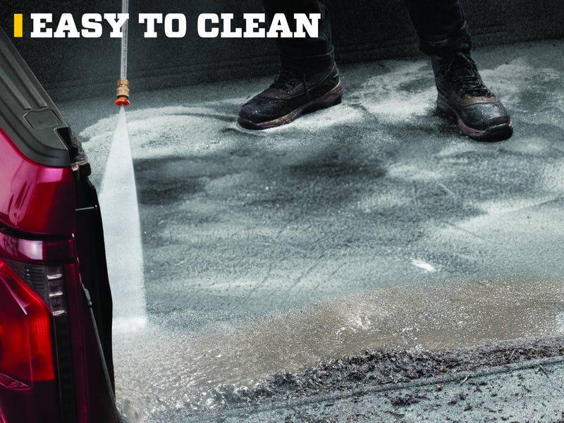 Husky Liners Guardian Comfort: pressure washer spraying a dirty gray carpet bed mat in a red pickup bed, boots in view