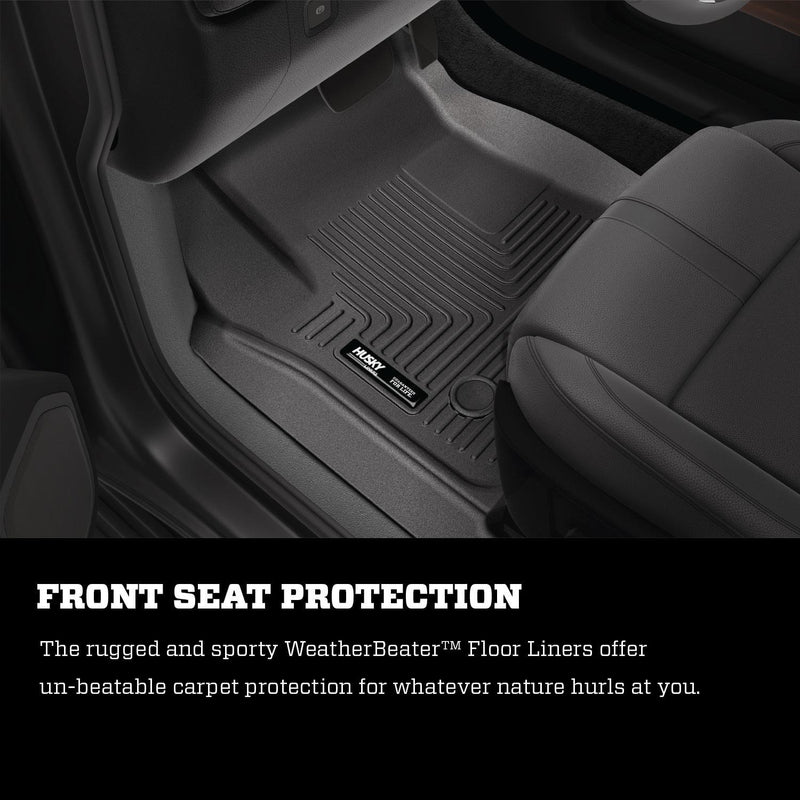 Husky Liners WeatherBeater: black front floor liner with Husky badge fitted in a driver footwell, black text panel below