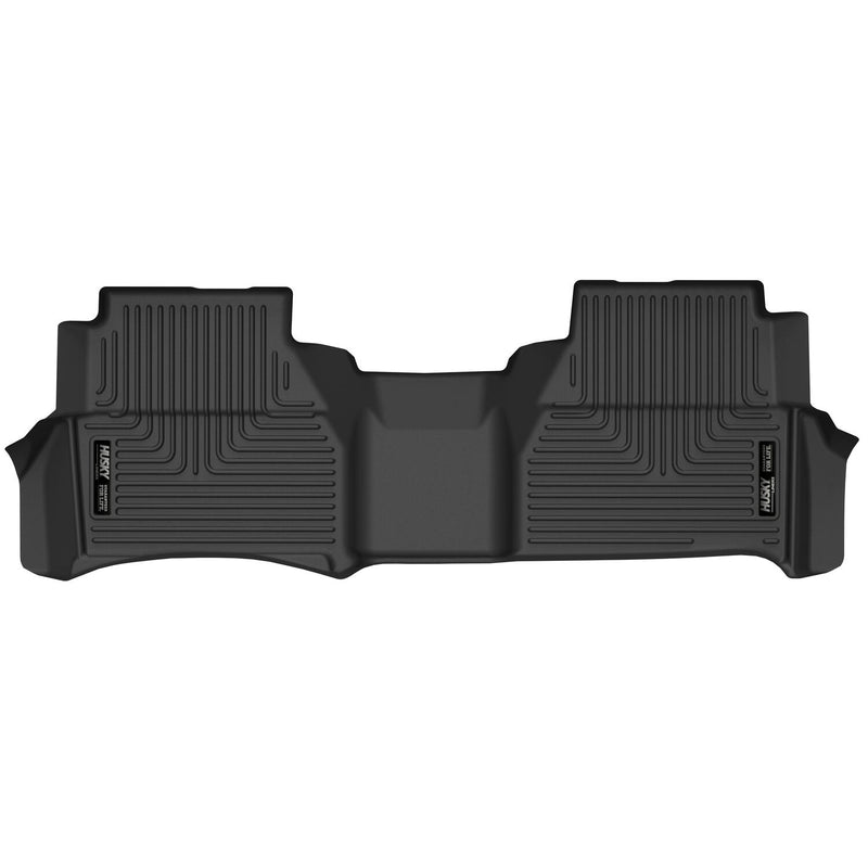 Husky Liners X-act Contour: black one-piece rear floor liner with a center hump section on white