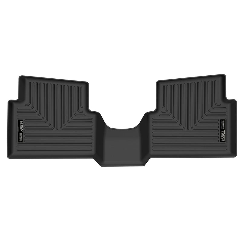 Husky Liners X-act Contour: black one-piece rear floor liner with a center hump section on white