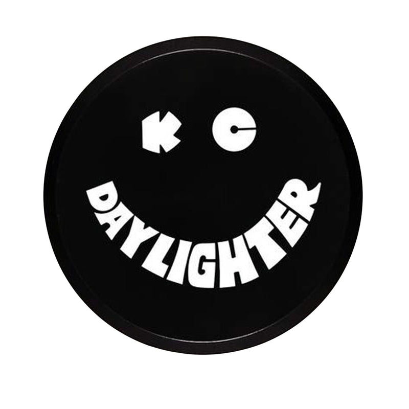 KC HiLiTES 6" Round Light Cover & Shield on a studio background: round black hard plastic KC Daylighter light cover with a white smiley face logo on a white background