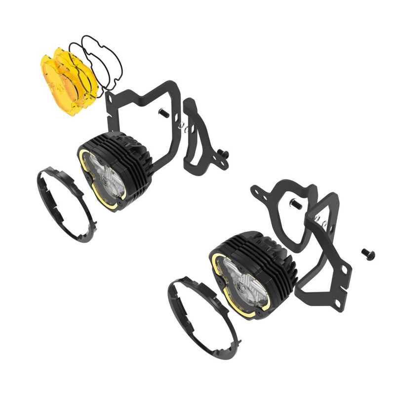 KC HiLiTES FLEX ERA 3 Dual-Mode SAE Fog Light Kit, Sport Bumper on a studio background: exploded view of two FLEX ERA 3 fog lights with Jeep sport bumper brackets, round shrouds and yellow lenses