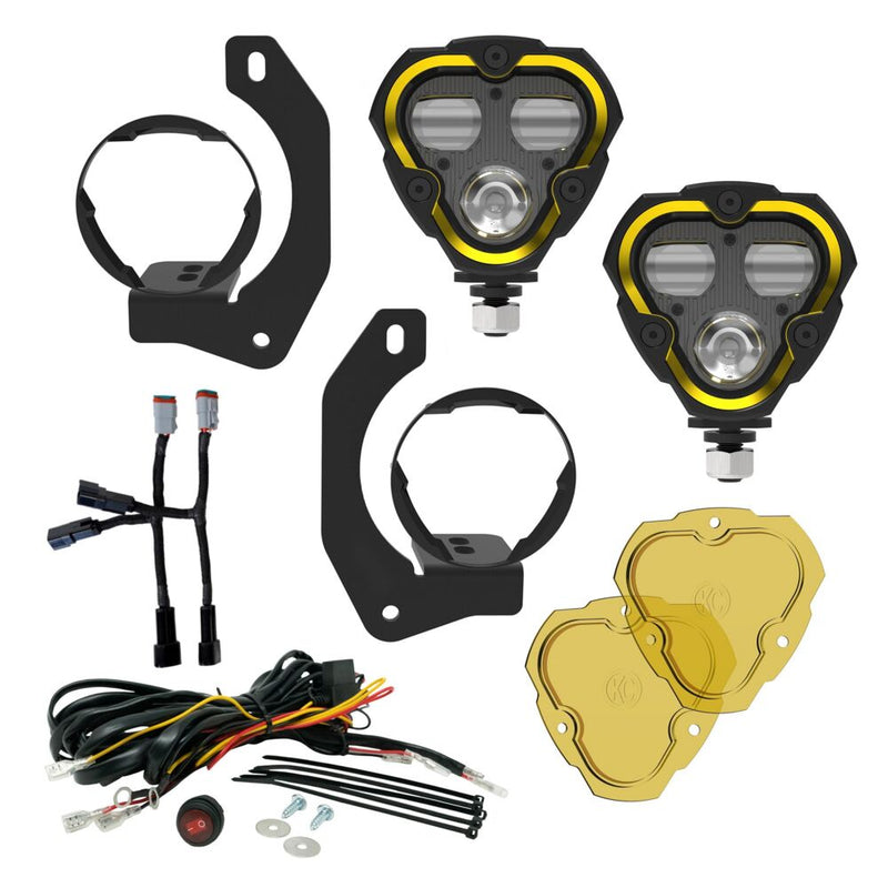 KC HiLiTES FLEX ERA 3 Dual-Mode SAE Fog Light Kit, Steel Bumper on a studio background: FLEX ERA 3 fog light kit laid out: two lights, steel bumper brackets, harness adapters, wiring harness with switch and two yellow lenses