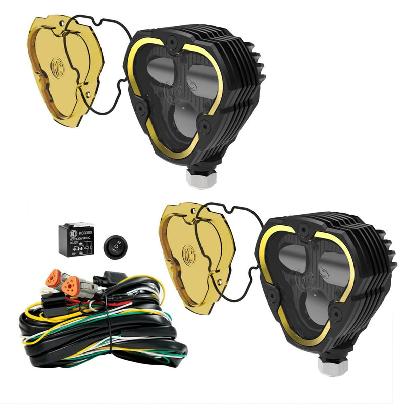 KC HiLiTES FLEX ERA 3 Dual-Mode SAE Fog Light Master Kit on a studio background: two FLEX ERA 3 Dual Mode fog LED lights with selective yellow lenses, a wiring harness, relay and switch on a white background