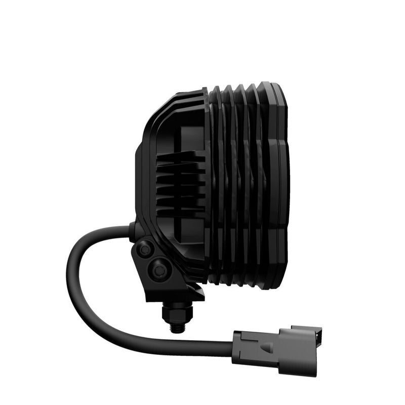 Close-up of the KC HiLiTES FLEX ERA 4 LED Light Pod Master Kit: side view of a FLEX ERA 4 LED light with its pigtail cable and connector