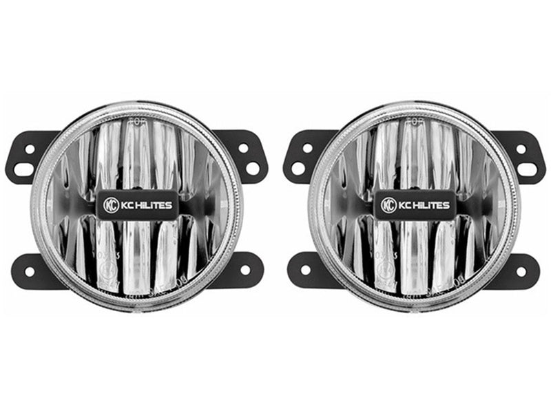 KC HiLiTES Gravity LED G4 4" Fog Light System, Steel Bumper on a studio background: pair of KC Gravity G4 4" round LED fog lights with clear lenses and Jeep style mounting ears, front view