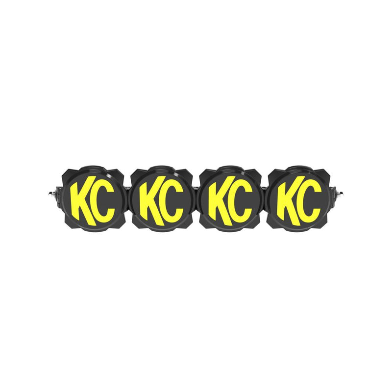 KC HiLiTES Gravity Titan LED Light Bar on a studio background: four-light LED light bar with black and yellow KC covers fitted over each light on a white background