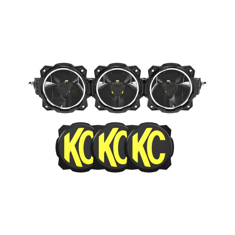 KC HiLiTES Gravity Titan LED Light Bar on a studio background: front view of a three-light black LED light bar with halo rings above three black and yellow KC covers