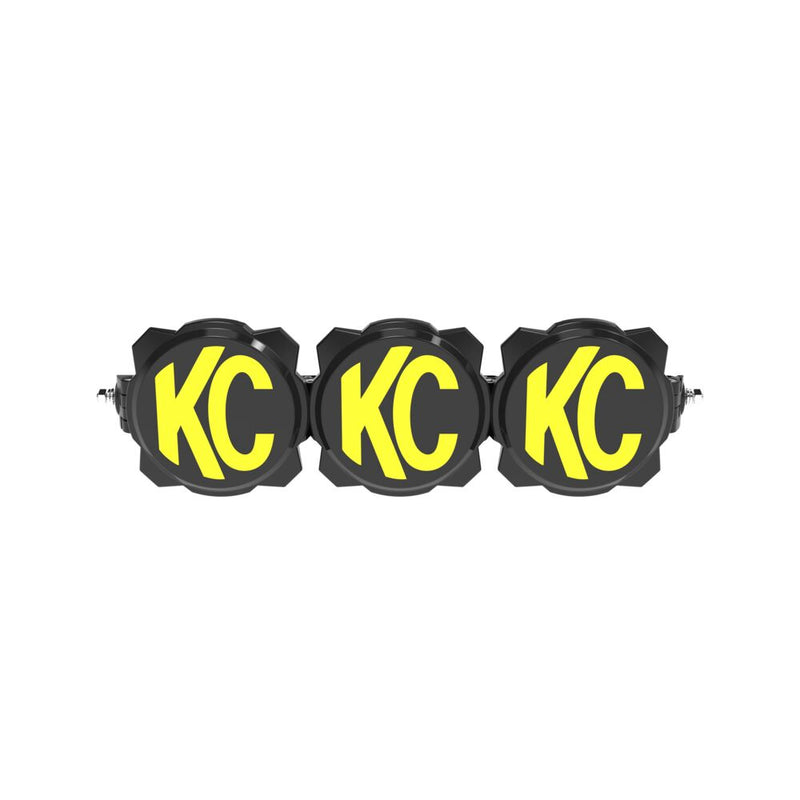 KC HiLiTES Gravity Titan LED Light Bar on a studio background: three-light black LED light bar with black and yellow KC covers fitted on each light