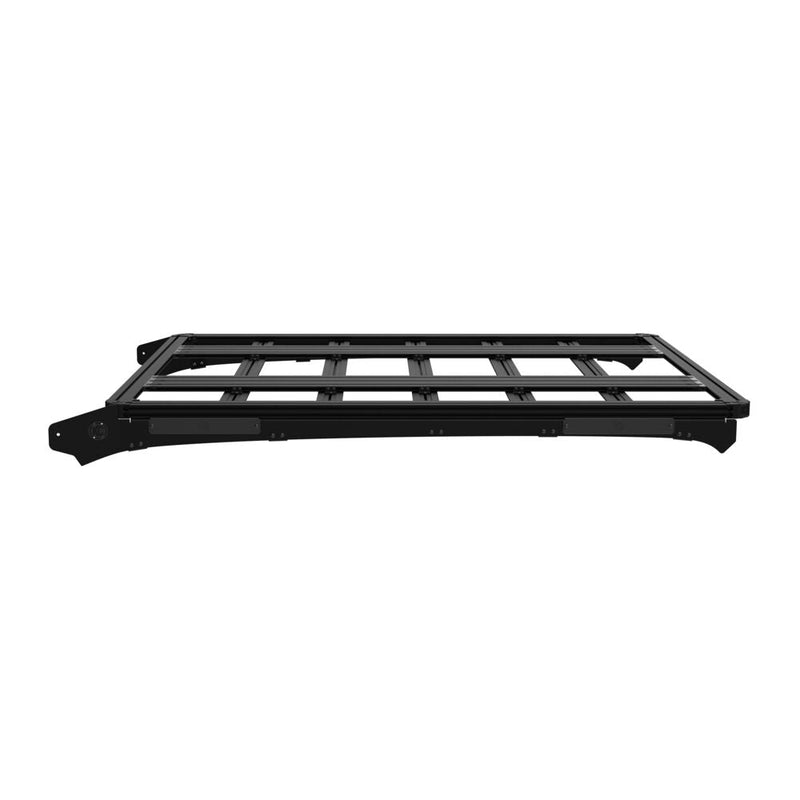 KC HiLiTES Platform One Roof Rack on a studio background: black aluminum KC Platform One roof rack with slotted crossbars and side mounting brackets, low side view on a white background