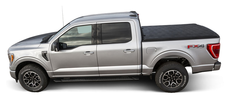 LEER Latitude soft folding tonneau cover on a pickup bed: side profile of a silver pickup with a black soft tonneau cover closed over the bed